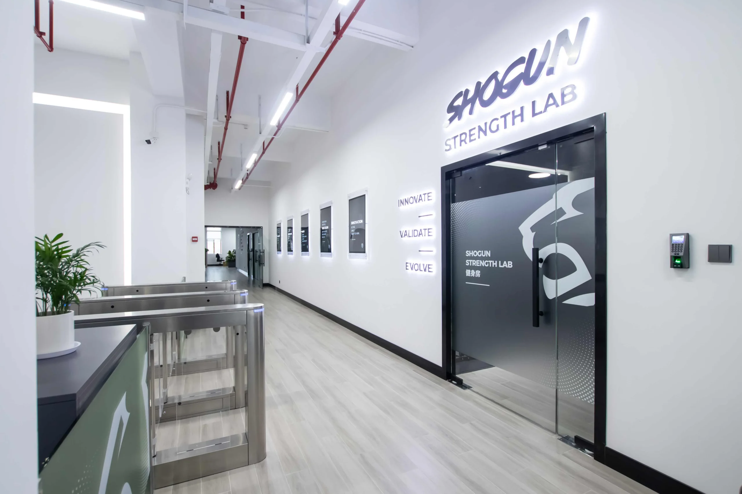 Security turnstiles and the Shogun Strength Lab entrance inside the Shield Works facility