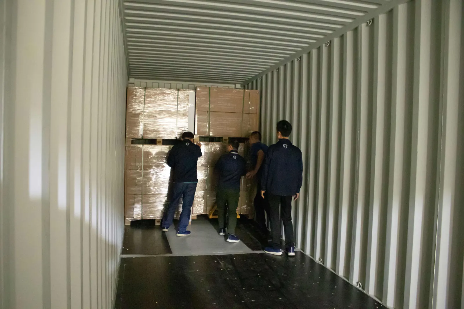 View from inside a container as pallets are loaded at the dock