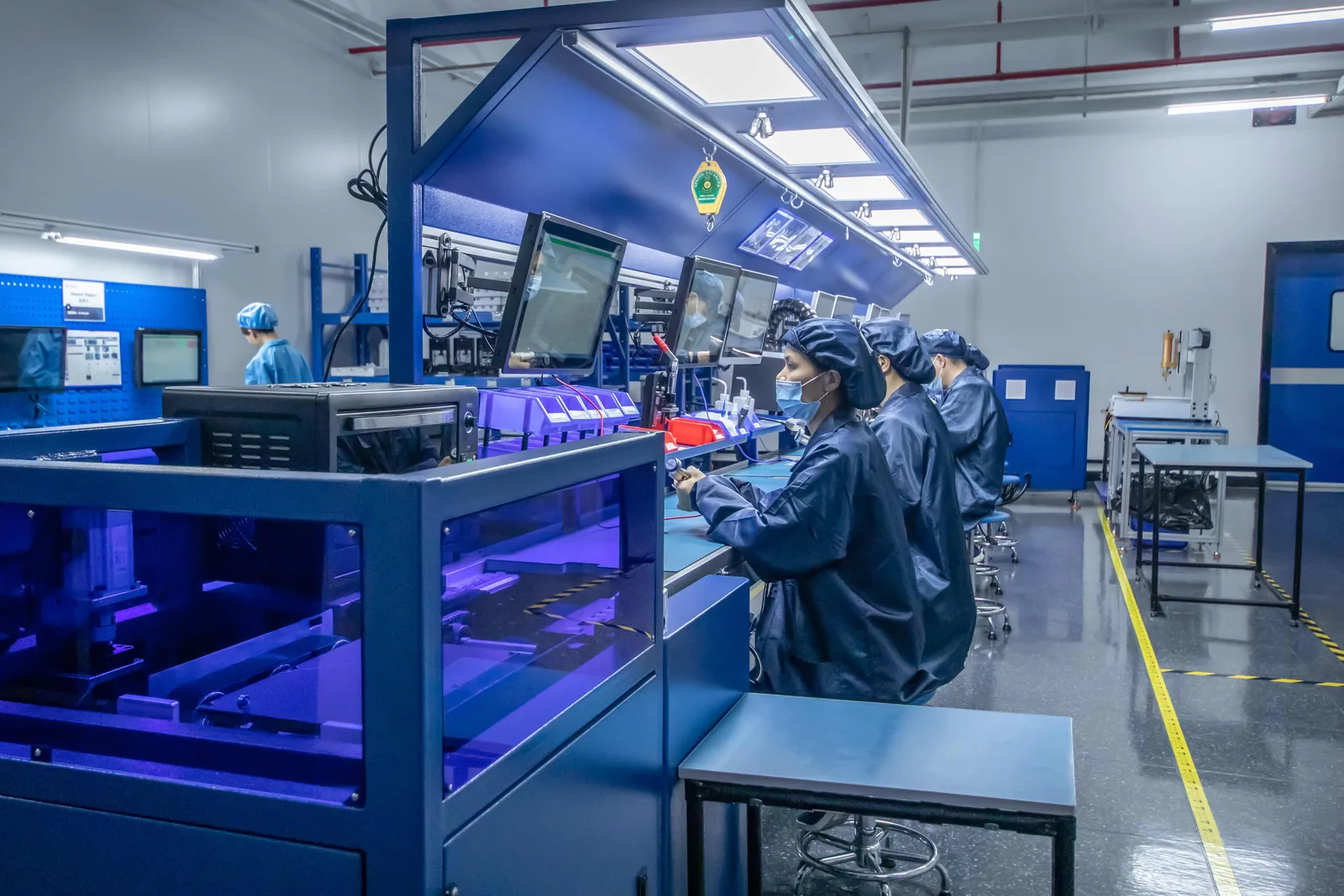 Box build stations inside the ESD-controlled electronics room at Shield Works in Zhuhai