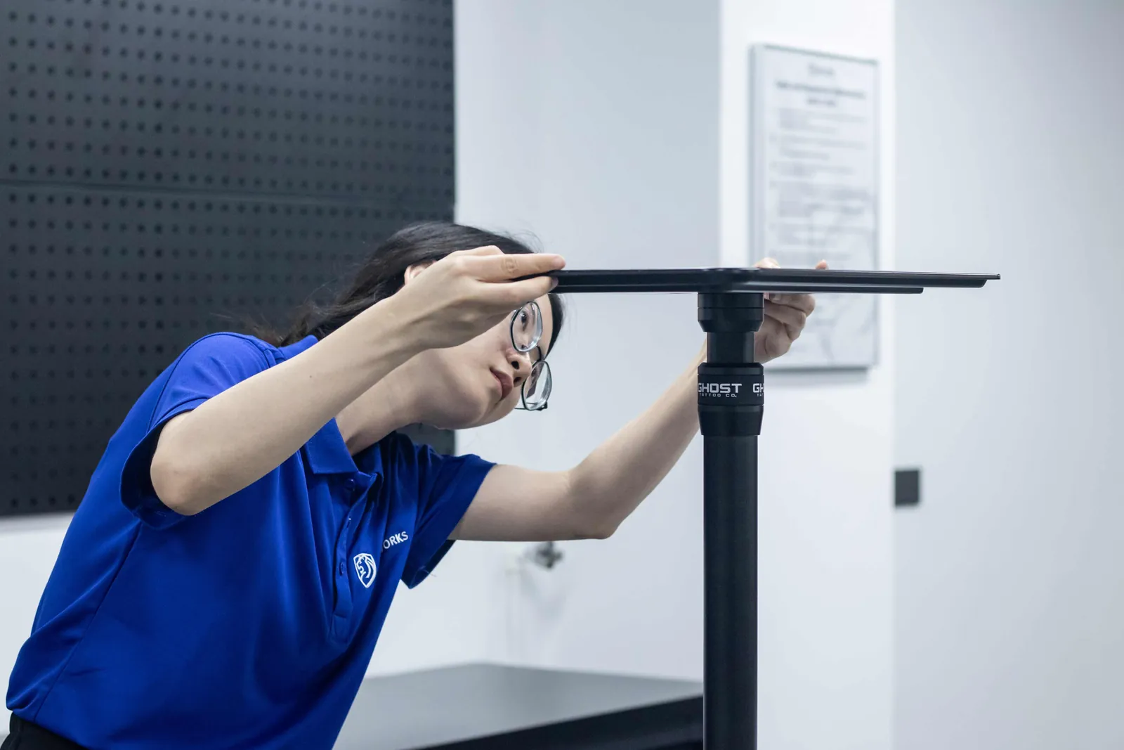 A Shield Works inspector measuring the height of a finished product against its specification