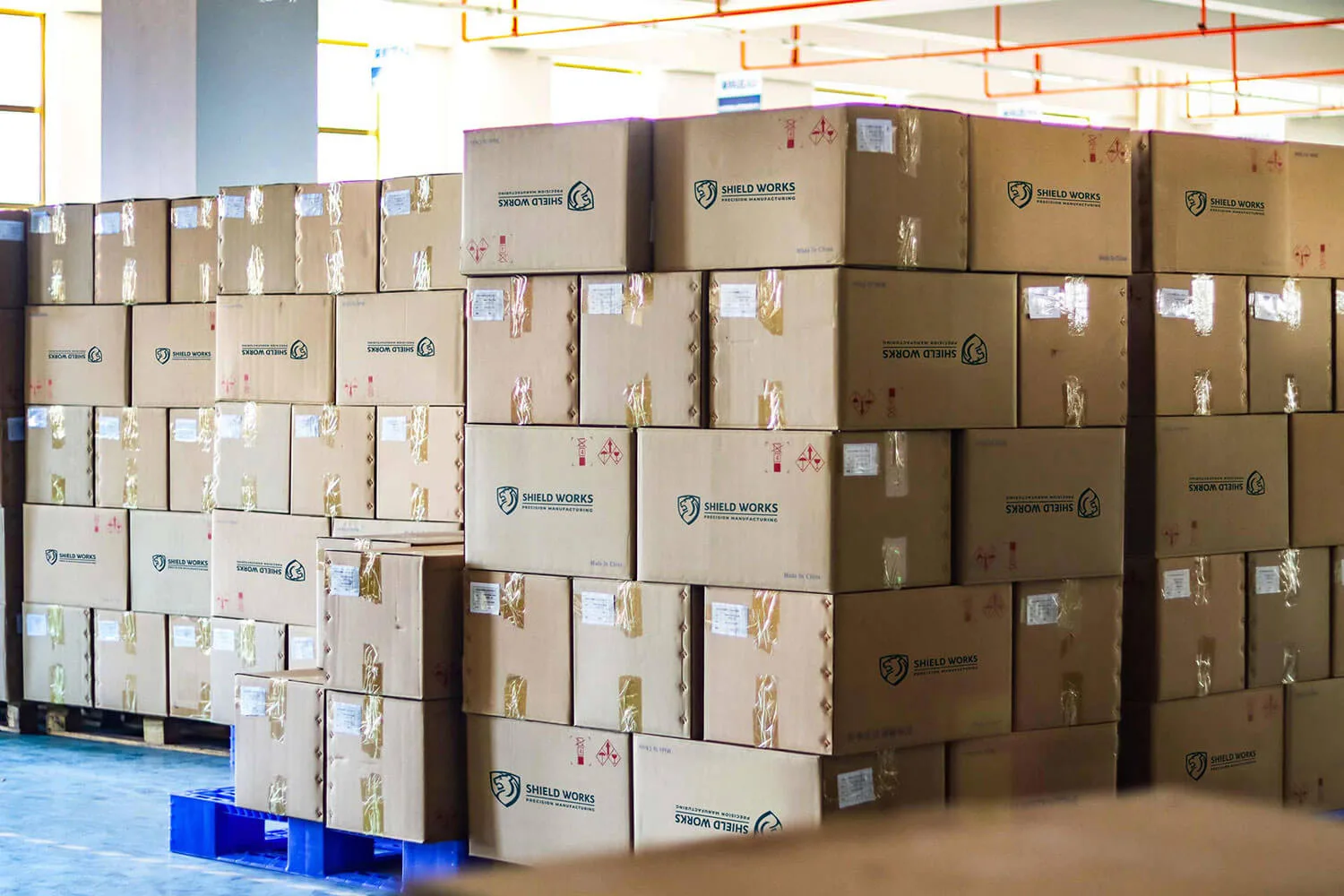 Cartons staged for consolidated dispatch in the Shield Works warehouse