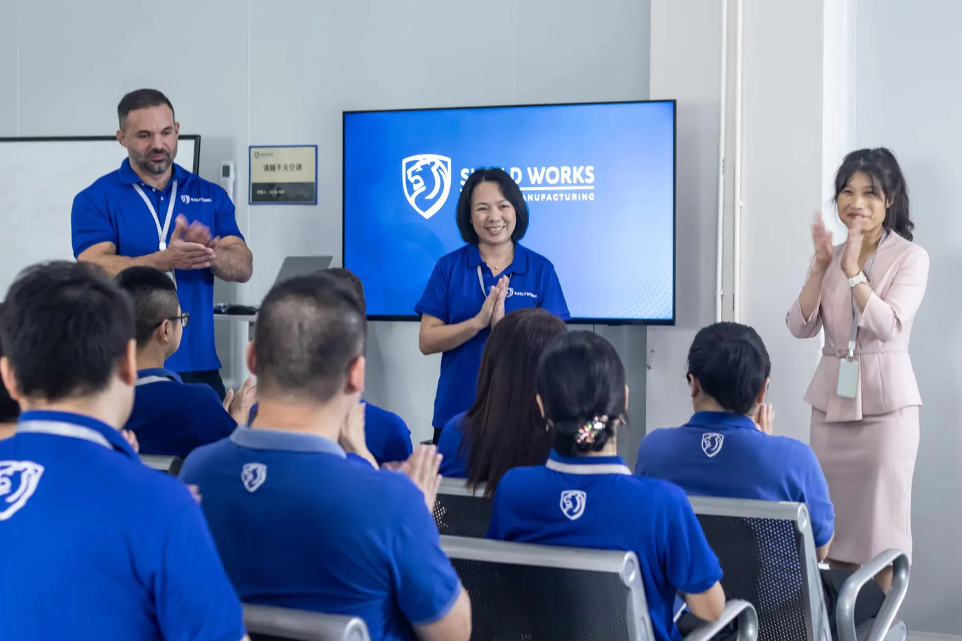 Shield Works leadership presenting a brand briefing to the team in Zhuhai